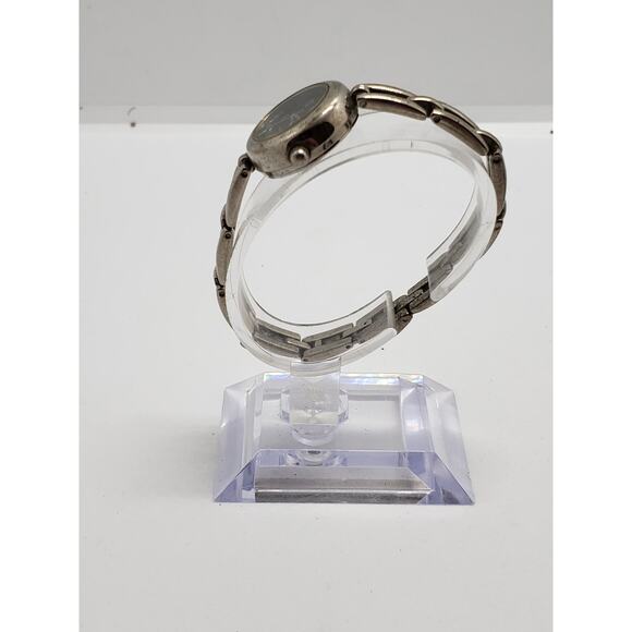 Women\'s Timex. Small black face. Bracelet style band.